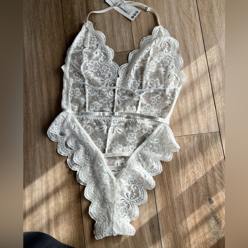 White lace body suit.